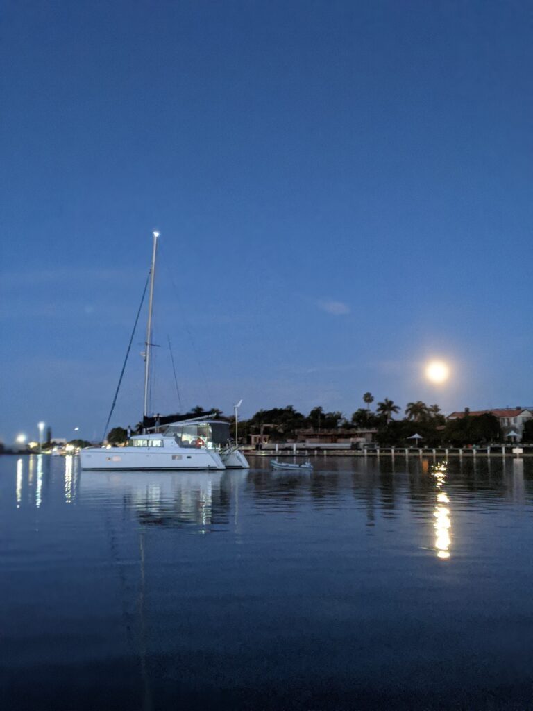 Scenic Night View of Beach with Yacht — Secondhand Boat Motors in Hervey Bay
