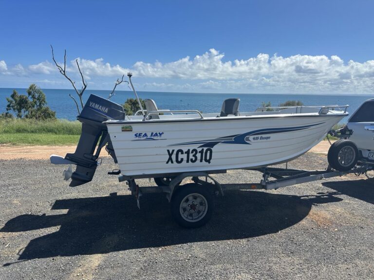 A Towed Yamaha Motorboat Parked on The Side of The Road — Secondhand Boat Motors in Hervey Bay