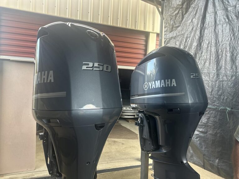 Two Yamaha Outboards Parked Side by Side, Ready for Use — Secondhand Boat Motors in Hervey Bay